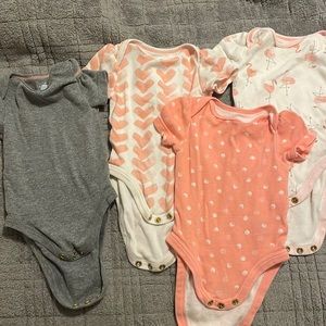 Four 0-3 month onesies